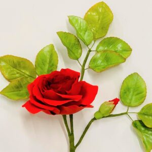 a red rose and realistic leaves made from sugar